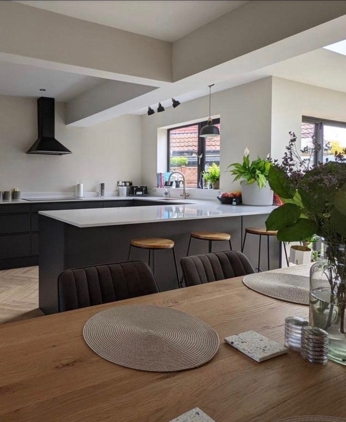 Refurbished open-plan kitchen diner with island and dining table